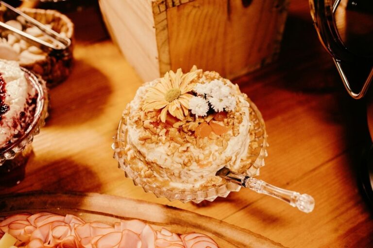 Cheeseball on fancy plate card club cheeseball recipe included