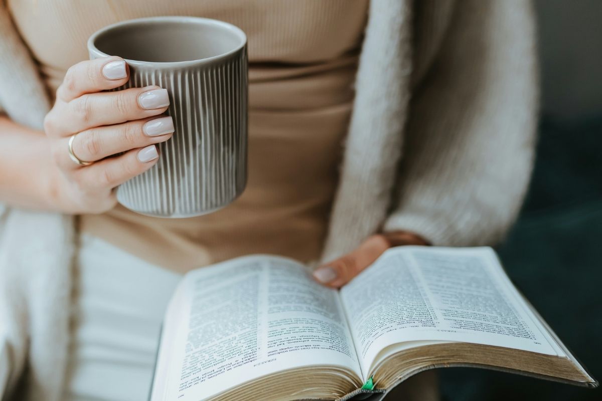Midlife woman reading Bible to deal with faith in real life